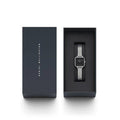 Daniel Wellington Quadro Studio DW00100522 kopen in luxe geschenkverpakking. Elegant dames horloge met vierkante zwarte wijzerplaat en zilveren mesh band.