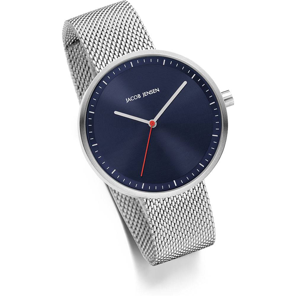 Jacob Jensen Strata JJ289 dameshorloge 36mm met zilverkleurige mesh band en donkerblauwe wijzerplaat, elegant en modern ontwerp.